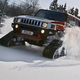 Image for article titled Hummer H3 + Tracks + Snow-Covered Nurburgring = Heroic Win